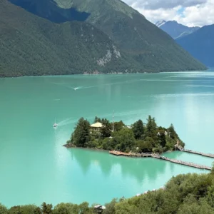 Basomtso Lake with turquoise water and mountains in Nyingchi Tibet