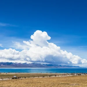 Sacred Namtso Lake with clear blue water and distant mountains in Tibet