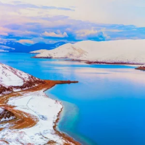 Winter landscape of Yamdrok Lake under clear Tibetan sky