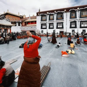 Pilgrims prostrating at Jokhang Temple in Lhasa